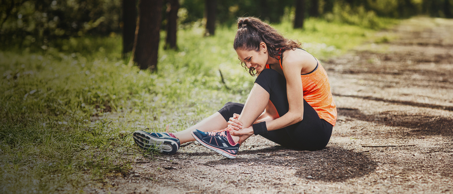 runner holding ankle