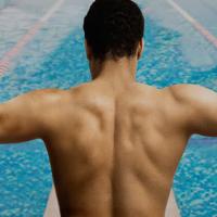 Man preparing to swim indoors