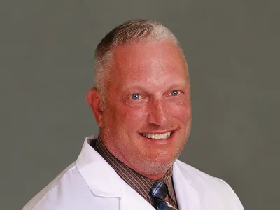 J. Travis Burt, M.D., F.A.A.N.S., F.A.C.S.